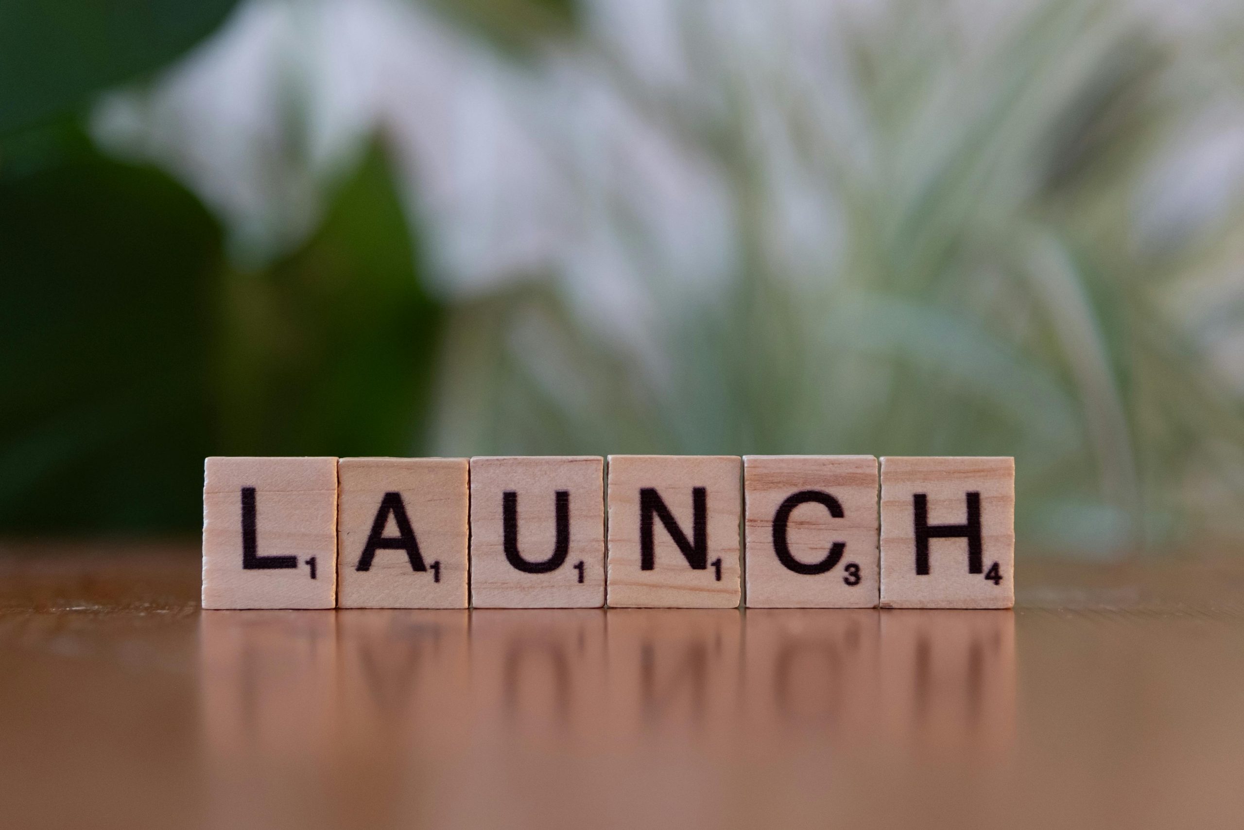Scrabble tiles spelling 'launch' reflecting entrepreneurship and innovation.